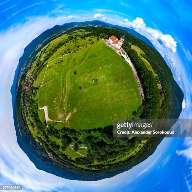 little planet aerial panoramic view of little church in vosges mountains, alsace, france. sunny summer day. eglise saint-gilles de saint-pierre-bois. - architecture bois stock pictures, royalty-free photos & images