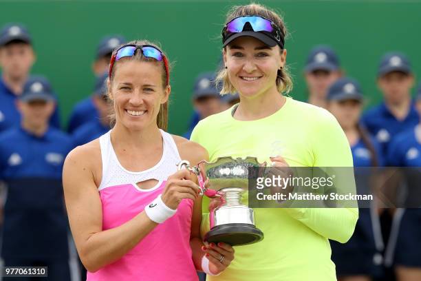 Alicja Rosolska of Poland and Abigail Spears of the United States pose with the winner's trophy during their women's doubles final match against...