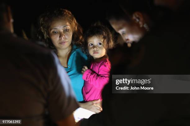 Central American asylum seekers, including a Honduran girl and her mother, are taken into custody near the U.S.-Mexico border on June 12, 2018 in...