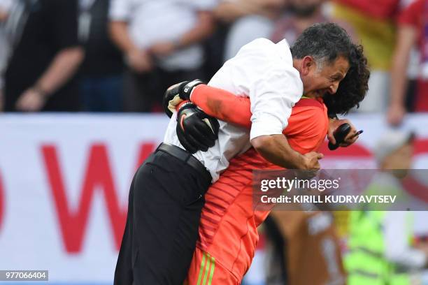 Mexico's coach Juan Carlos Osorio celebrates their win with Mexico's goalkeeper Guillermo Ochoa during the Russia 2018 World Cup Group F football...