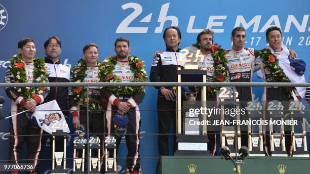 Japanese driver Kamui Kobayashi , British driver Mike Conway and Argentinian driver Jose Maria Lopez, Toyota's head of motorsport, Shigeki Tomoyama ,...