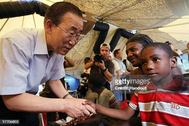 In this handout image provided by the United Nations Stabilization Mission in Haiti , The Secretary-General of the United Nations, Ban Ki-Moon greets...