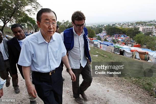 In this handout image provided by the United Nations Stabilization Mission in Haiti , The Secretary-General of the United Nations, Ban Ki-Moon, walks...