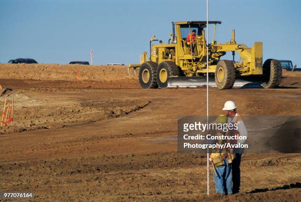 Setting grade for highway project, Fresno County, California, USA.