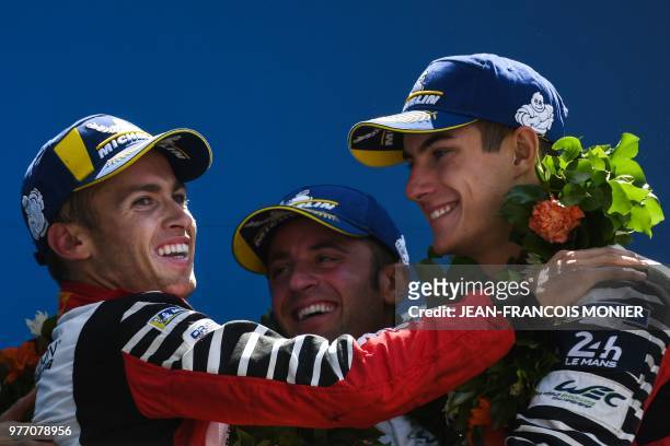 Rebellion R13 Gibson LMP1 US driver Gustavo Menezes, Swiss driver Mathias Beche and French driver Thomas Laurent celebrate their third place of the...