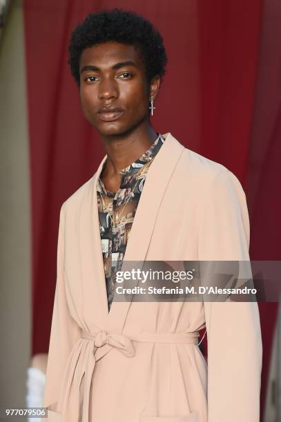 Model poses at Triple RRR presentation during Milan Men's Fashion Week Spring/Summer 2019 on June 17, 2018 in Milan, Italy.