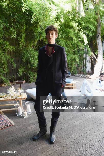 Model poses at Triple RRR presentation during Milan Men's Fashion Week Spring/Summer 2019 on June 17, 2018 in Milan, Italy.