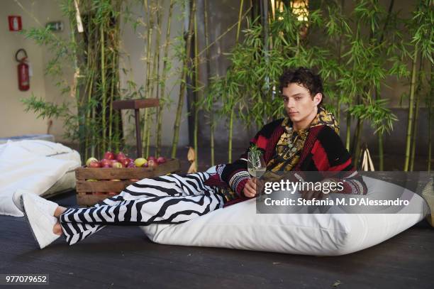 Model poses at Triple RRR presentation during Milan Men's Fashion Week Spring/Summer 2019 on June 17, 2018 in Milan, Italy.