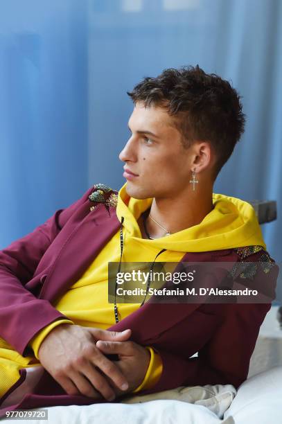 Model poses at Triple RRR presentation during Milan Men's Fashion Week Spring/Summer 2019 on June 17, 2018 in Milan, Italy.