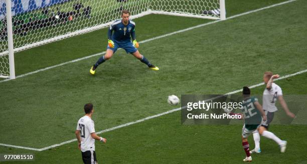 Hirving Lozano of Mexico, right, shoots to score a goal against goalkeeper Manuel Neuer of Germany in their Group F match during the 2018 FIFA World...