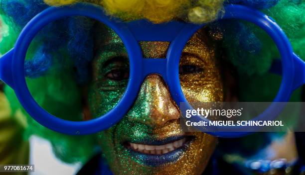 Supporters of Brazil gather to watch the broadcasting 2018 FIFA World Cup Group E Brazil v Switzerland match at the public viewing event in Sao...