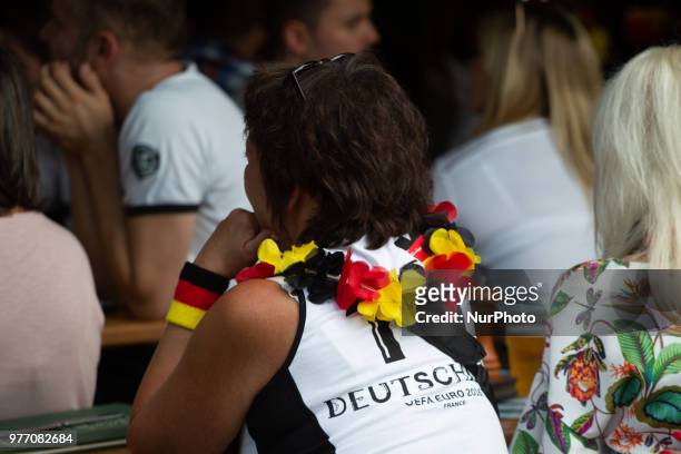Person wearing a flower chain with the German national colors. Some impressions of the fans watching the Germany vs Mexico match of the FIFA world...