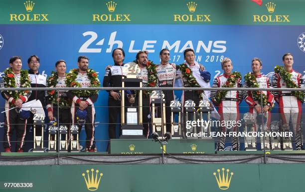 Japanese driver Kamui Kobayashi , British driver Mike Conway and Argentinian driver Jose Maria Lopez, Toyota's head of motorsport, Shigeki Tomoyama ,...