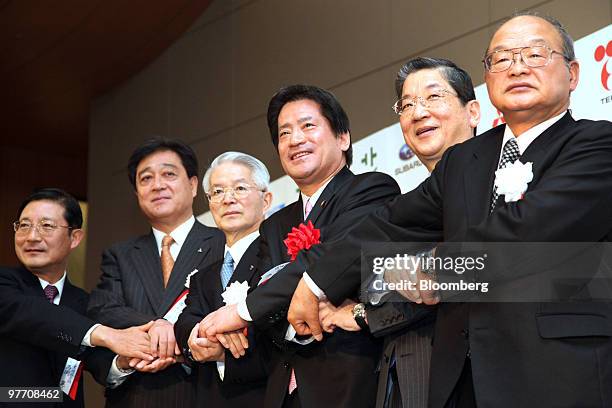 Akira Mabuchi, senior vice president of Fuji Heavy Industries Ltd., Osamu Masuko, president of Mitsubishi Motors Corp., Tsunehisa Katsumata, chairman...