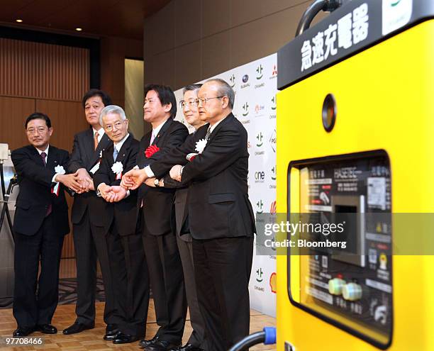 Akira Mabuchi, senior vice president of Fuji Heavy Industries Ltd., Osamu Masuko, president of Mitsubishi Motors Corp., Tsunehisa Katsumata, chairman...