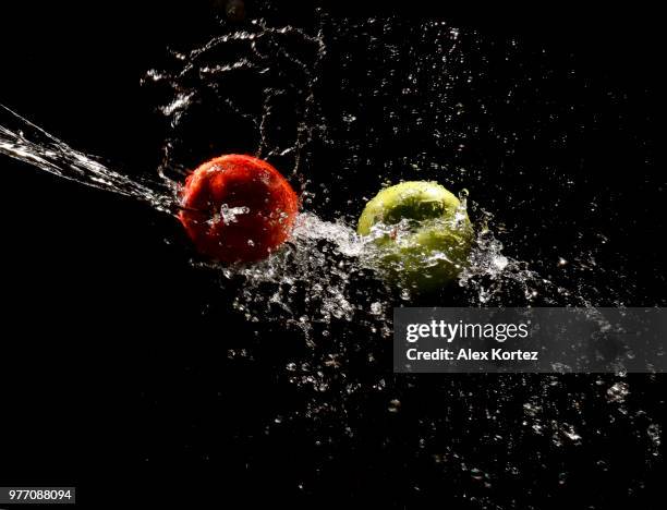 apples in splashing water - water apples stock pictures, royalty-free photos & images
