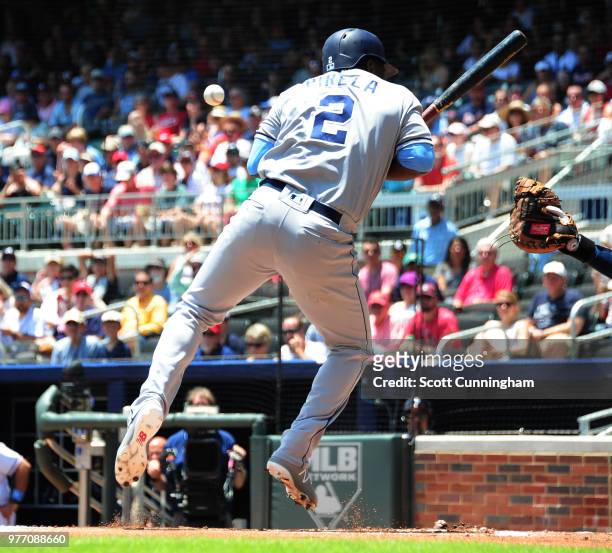 Jose Pirela of the San Diego Padres is hit by a first inning pitch against the Atlanta Braves at SunTrust Field on June 17, 2018 in Atlanta, Georgia.