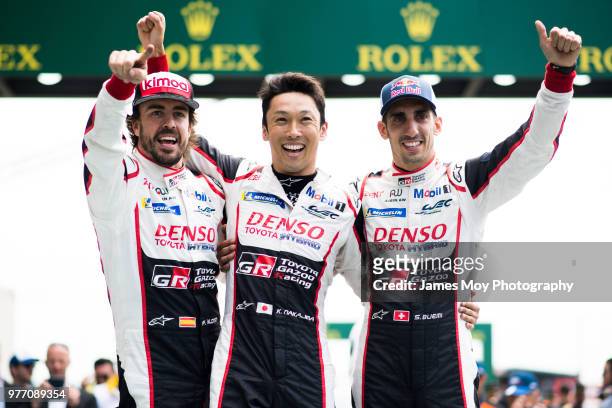 Race winners Toyota Gazoo Racing - Fernando Alonso of Spain, Kazuki Nakajima of Japan and Sebastien Buemi of Switzerland, celebrate in parc ferme at...