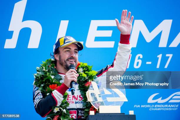 Race winner Fernando Alonso of Spain and Toyota Gazoo Racing celebrates on the podium at the Le Mans 24 Hour race on June 17, 2018 in Le Mans, France.
