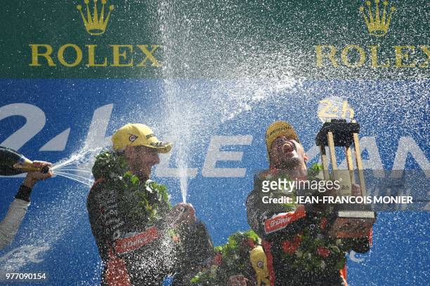 Oreca 07 Gibson LM P2 French driver Andrea Pizzitola and Oreca 07 Gibson LM P2 French driver Jean-Eric Vergne spray champagne as they celebrate...
