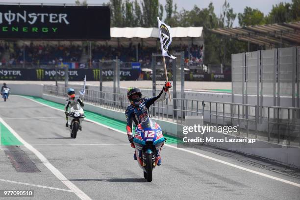 Marco Bezzecchi of Italy and Pruestel GP remembers Andreas Perez of Spain with flag at the end of the Moto3 race during the MotoGp of Catalunya -...