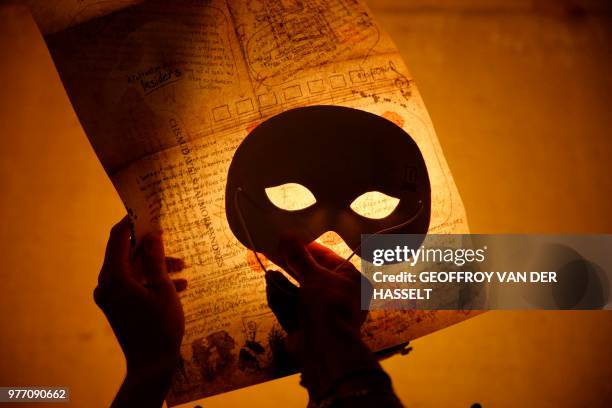 Picture shows a paper used in an "escape game" session at the Opera Garnier in Paris, on June 4, 2018. - Participants of these games are expected to...