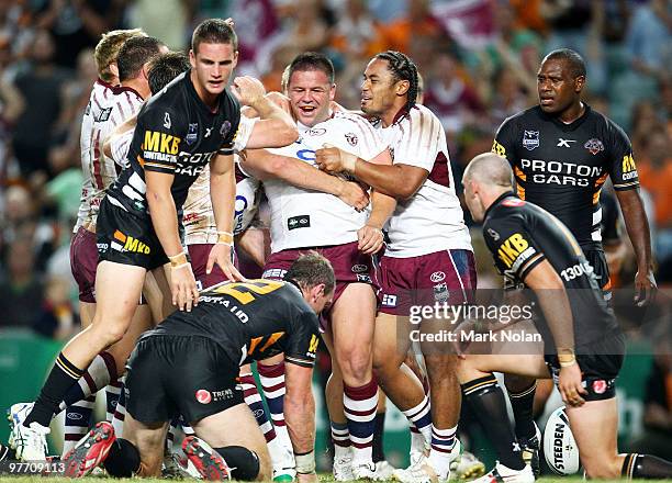 George Rose of Manly celebrates his try during the round one NRL match between the Wests Tigers and the Manly Warringah Sea Eagles at the Sydney...