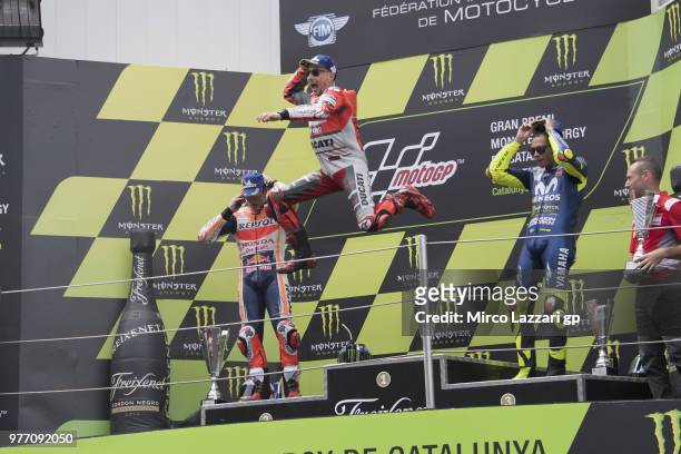 Jorge Lorenzo of Spain and Ducati Team celebrates the victory with jump on the podium at the end of the MotoGP race during the MotoGp of Catalunya -...