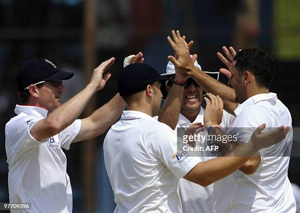 England cricketer Tim Bresnan celebrates with his teammates the dismissal of the Bangladeshi cricketer Afthab Ahmad during the fourth day of the...
