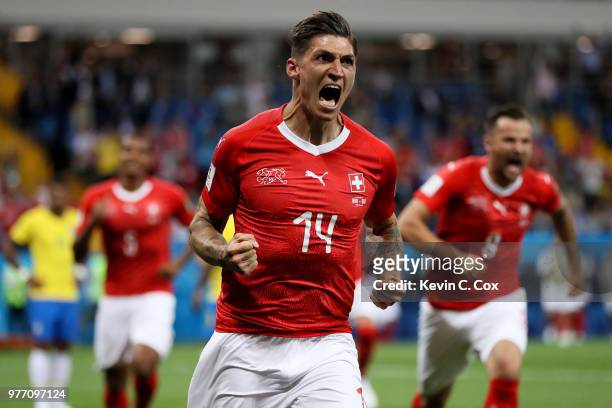 Steven Zuber of Switzerland celebrates after scoring his team's first goal during the 2018 FIFA World Cup Russia group E match between Brazil and...