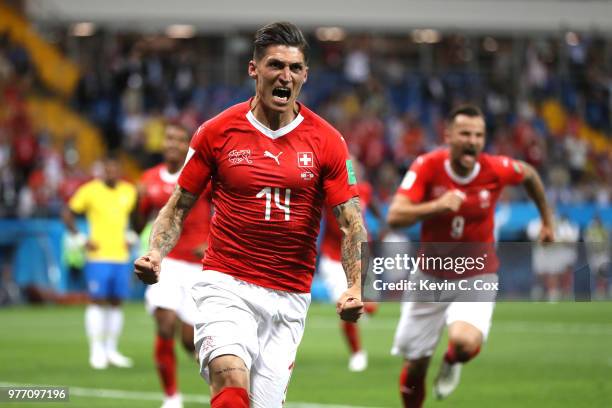 Steven Zuber of Switzerland celebrates after scoring his team's first goal during the 2018 FIFA World Cup Russia group E match between Brazil and...