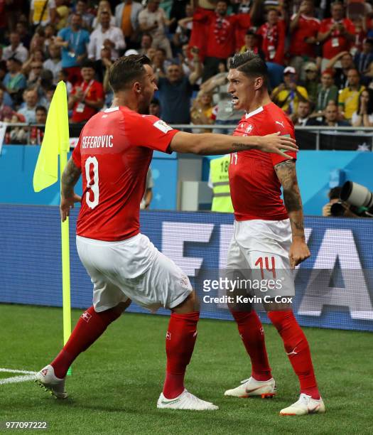 Steven Zuber of Switzerland celebrates with teammate Haris Seferovic after scoring his team's first goal during the 2018 FIFA World Cup Russia group...