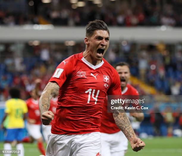 Steven Zuber of Switzerland celebrates after scoring his team's first goal during the 2018 FIFA World Cup Russia group E match between Brazil and...