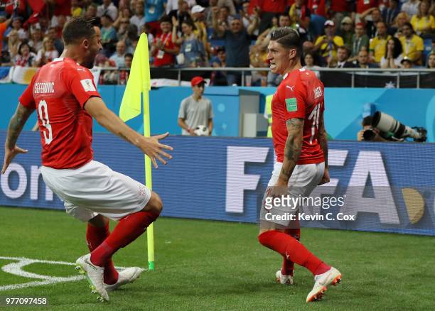 Steven Zuber of Switzerland celebrates with teammate Haris Seferovic after scoring his team's first goal during the 2018 FIFA World Cup Russia group...