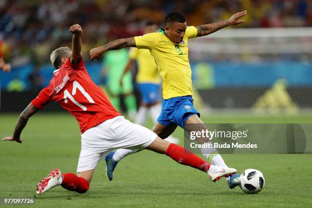 Valon Behrami of Switzerland tackles Gabriel Jesus of Brazil during the 2018 FIFA World Cup Russia group E match between Brazil and Switzerland at...