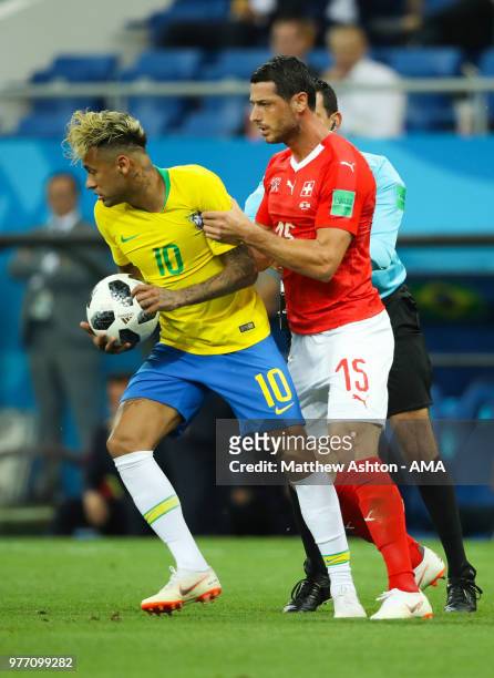 Neymar of Brazil tangles with Blerim Dzemaili of Switzerland during the 2018 FIFA World Cup Russia group E match between Brazil and Switzerland at...