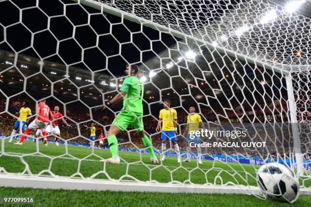 Switzerland's midfielder Steven Zuber scores a goal past Brazil's goalkeeper Alisson during the Russia 2018 World Cup Group E football match between...