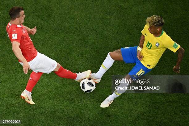 Brazil's forward Neymar vies with Switzerland's forward Xherdan Shaqiri during the Russia 2018 World Cup Group E football match between Brazil and...