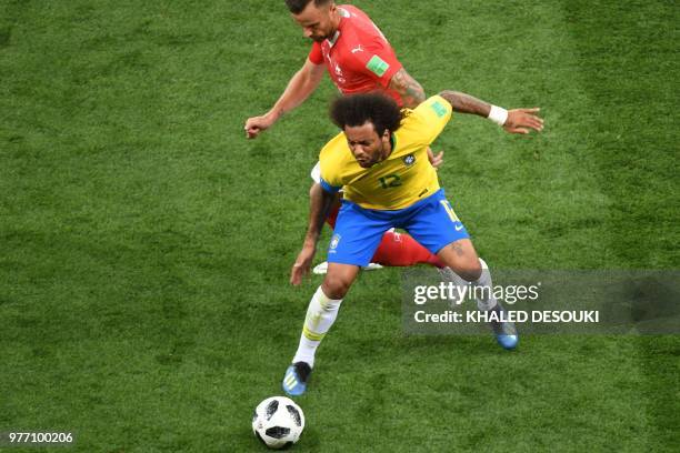 Brazil's defender Marcelo vies with Switzerland's forward Haris Seferovic during the Russia 2018 World Cup Group E football match between Brazil and...