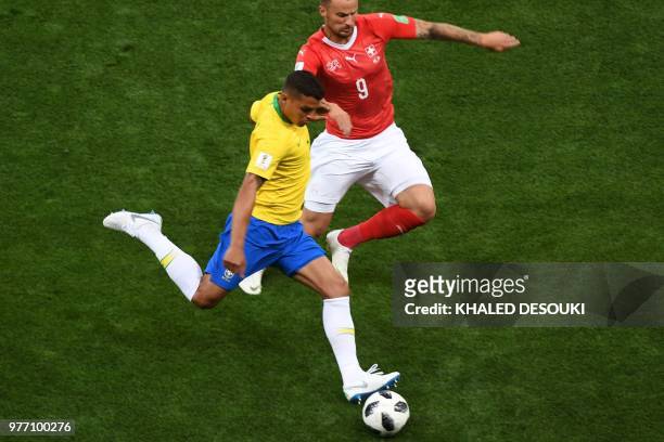 Brazil's defender Thiago Silva vies with Switzerland's forward Haris Seferovic during the Russia 2018 World Cup Group E football match between Brazil...