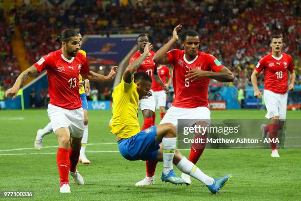 Gabriel Jesus of Brazil is challenged in the penalty area by Manuel Akanji of Switzerland during the 2018 FIFA World Cup Russia group E match between...