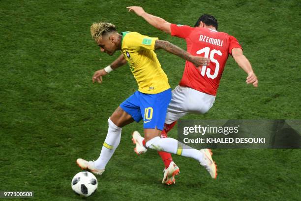 Brazil's forward Neymar fights for the ball with Switzerland's midfielder Blerim Dzemaili during the Russia 2018 World Cup Group E football match...