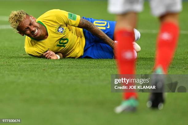 Brazil's forward Neymar reacts during the Russia 2018 World Cup Group E football match between Brazil and Switzerland at the Rostov Arena in...