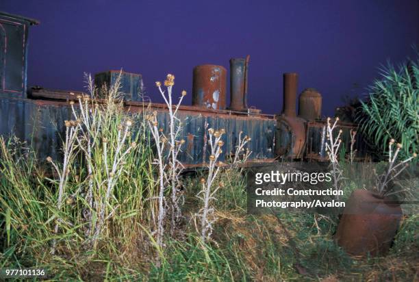 Rusted tones on the locomotive dump at Vartholomio on the Greek Peloponnese. The two Z Class 2-6-0S are No 7504 left SA Graffenstaden 1890 and right...