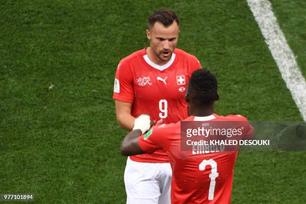 Switzerland's forward Haris Seferovic is substituted by Switzerland's forward Breel Embolo during the Russia 2018 World Cup Group E football match...