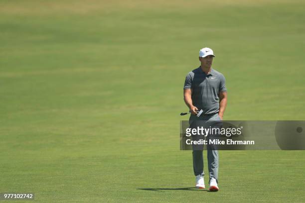Brooks Koepka of the United States walks up the first green during the final round of the 2018 U.S. Open at Shinnecock Hills Golf Club on June 17,...