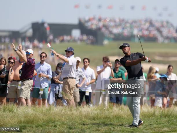 Tony Finau of the United States plays his second shot into the third green during the final round of the 2018 U.S. Open at Shinnecock Hills Golf Club...