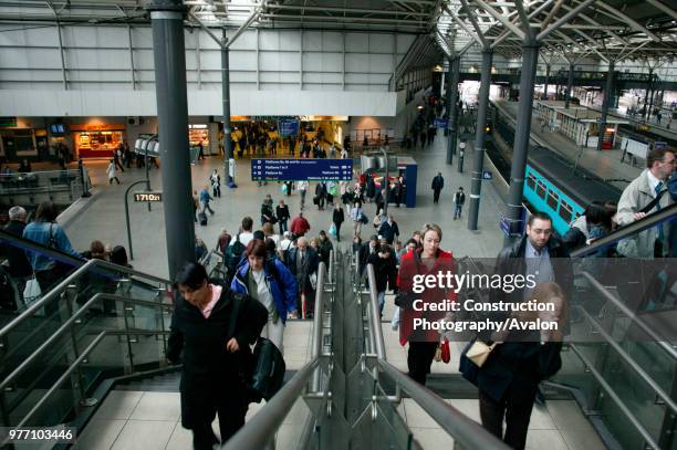 Rush hour at Leeds station as travellers ascend the station overbridge. May 2005, United Kingdom.