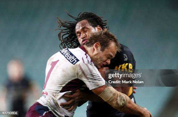 Brett Stewart of the Eagles tackles Lote Tuqiri of the Tigers during the round one NRL match between the Wests Tigers and the Manly Warringah Sea...