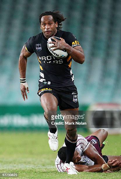 Lote Tuqiri of the Tigers makes a line break during the round one NRL match between the Wests Tigers and the Manly Warringah Sea Eagles at the Sydney...